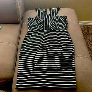 Form fitting black striped zipper back dress